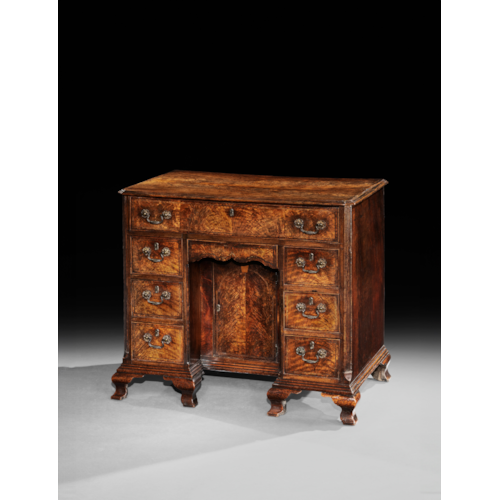A George II Fiddleback Walnut Kneehole Desk